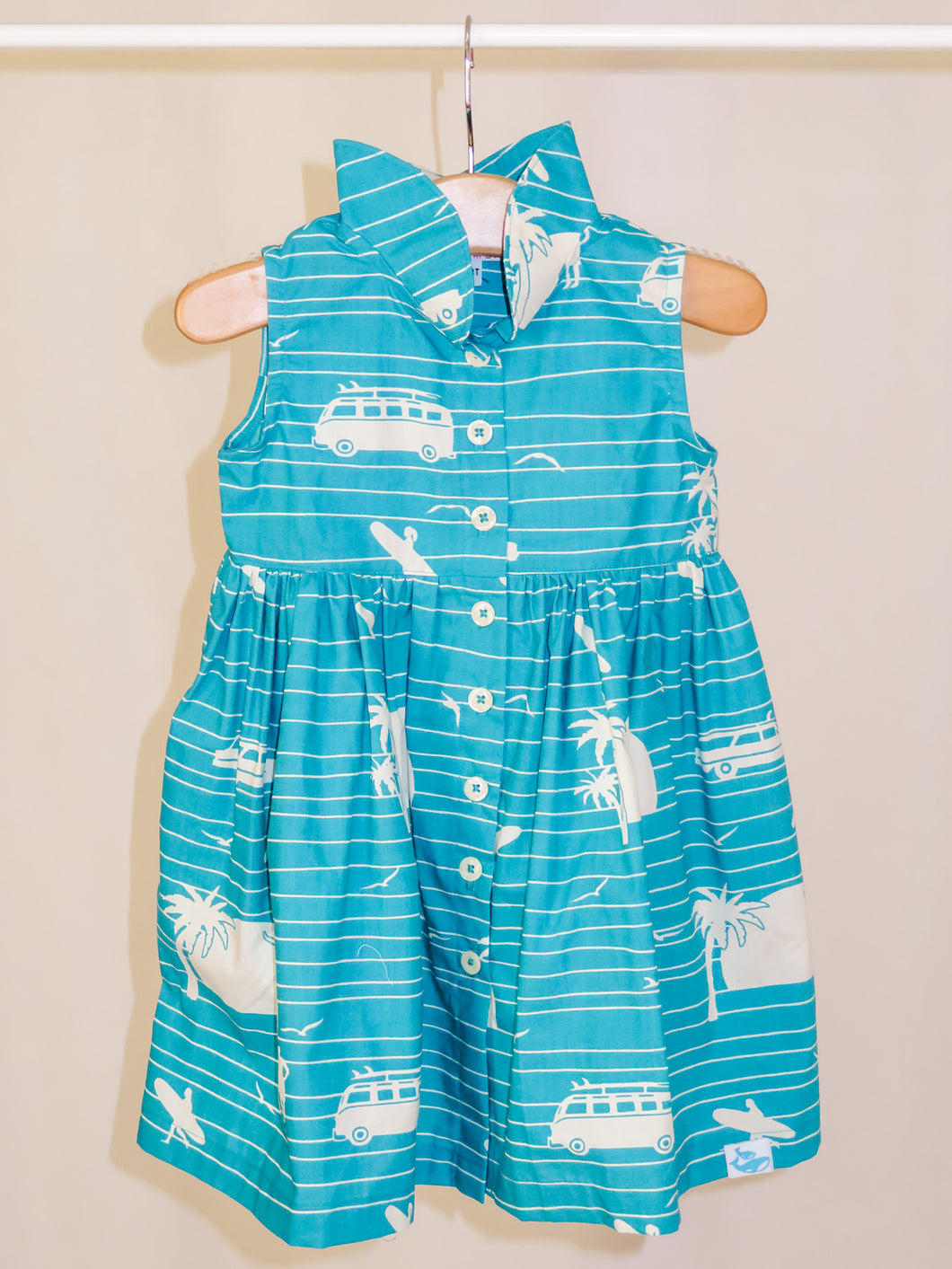 Our playful, button-up dress has just the right amount of poof and twirl.  The sleeveless style lets your child play with ease and we even added pockets so your littles can stow away their treasures.