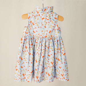 The back of the children's sleeveless shirt dress with collar in "under the sea" print.