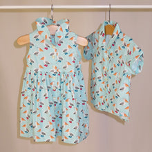 Load image into Gallery viewer, Children&#39;s dress in pelican print. Baby blue with cute pelicans. 